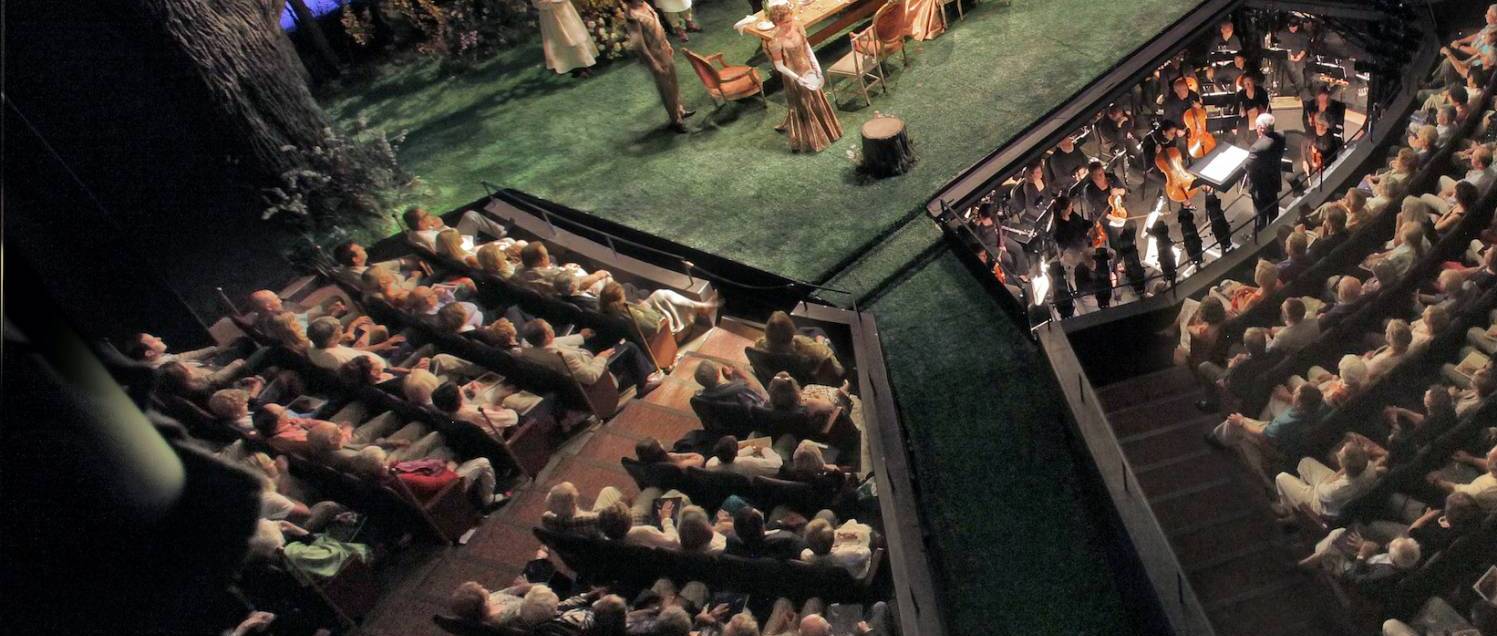 An overhead shot of a full theater with a performance of A Little Night Music onstage.